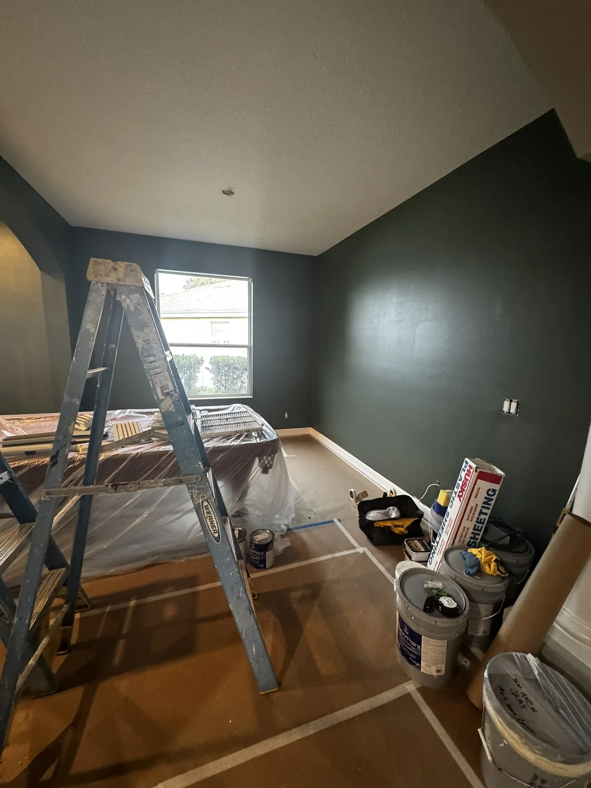 Dark accent room painting workspace