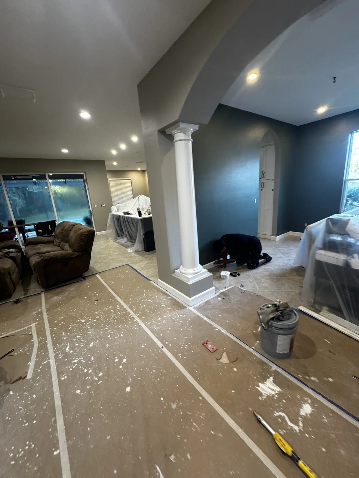Protected open living area during painting